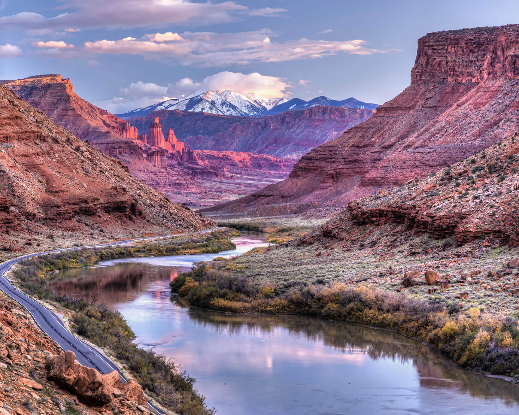 The Colorado River and Fisher Towers near Castle Valley, Utah, with the La Sal Mountains in the background.